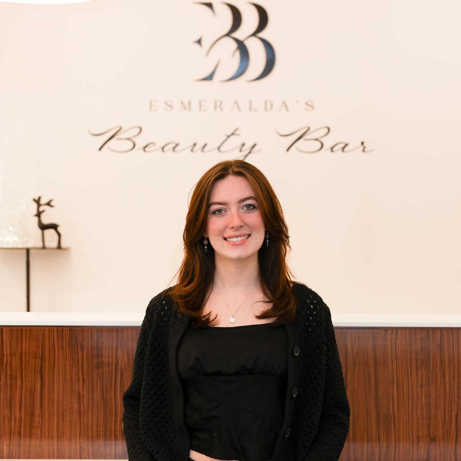 Portrait of Anna, a professional stylist at Esmeralda’s Beauty Bar, showcasing their expertise and style.