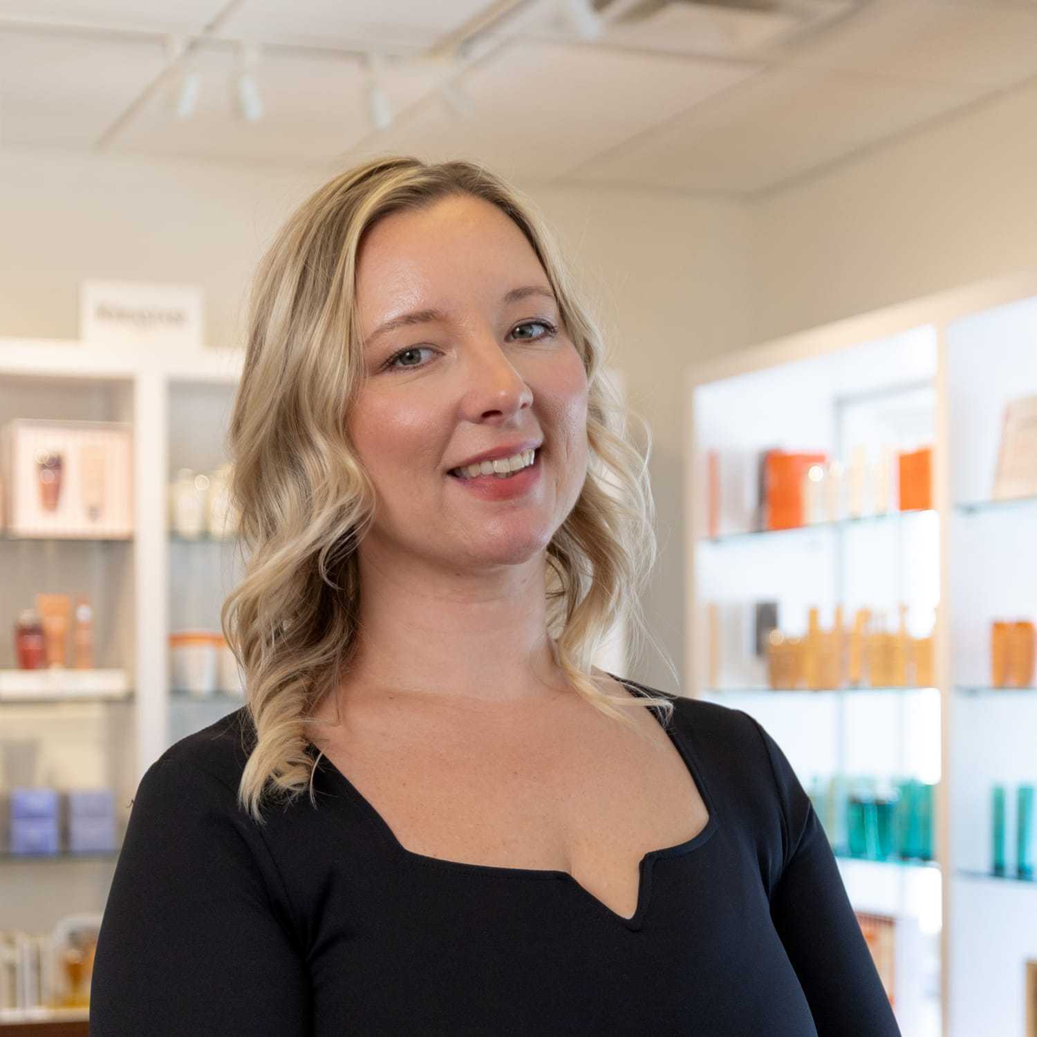 Portrait of Amanda, a professional stylist at Esmeralda’s Beauty Bar, showcasing their expertise and style.